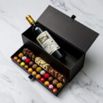 Chest of selections, wine, champagne or liquor with an assortment of chocolate bonbons, truffles and mediants