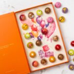 Orange bonbons box with balloons Illustration