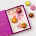 Pink bonbons box with balloons Illustration